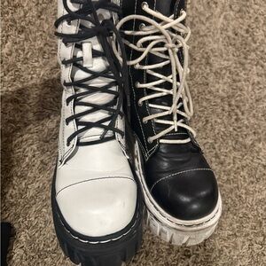 Black and white Current Mood platform boots mismatched